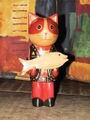 Wooden cat holding a fish.jpg